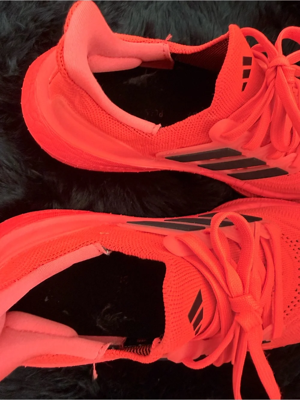 adidas red orange Ultraboost Running Sneakers.
